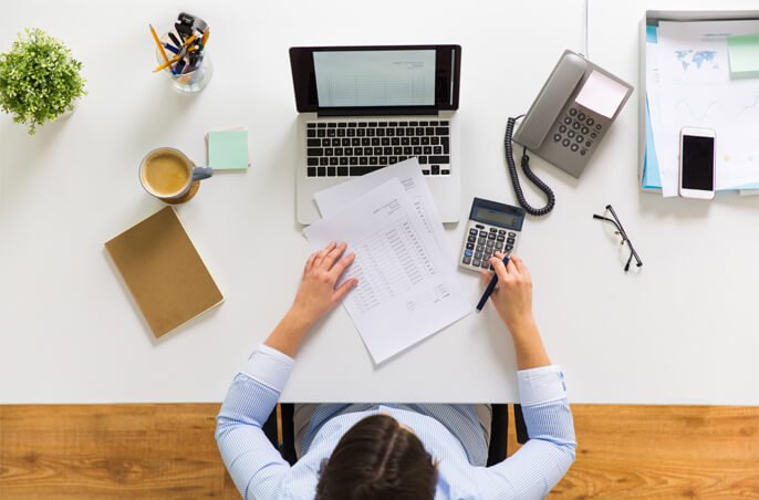 Top view of business women at desk.